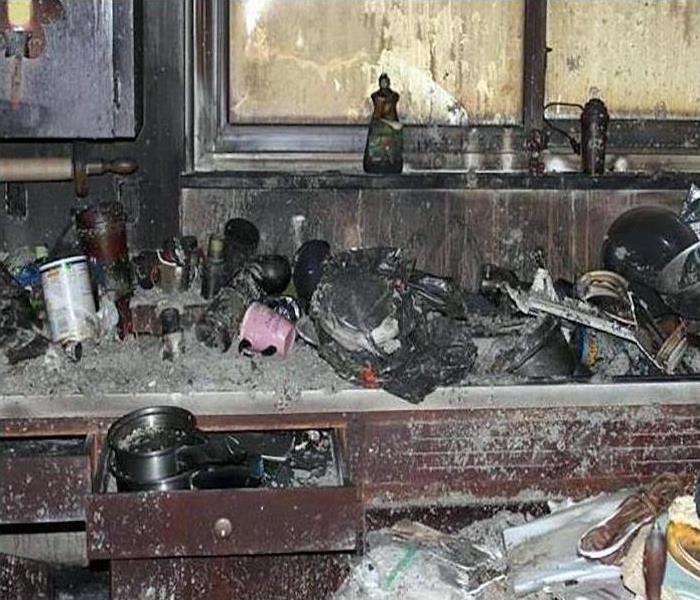 fire damaged kitchen with debris