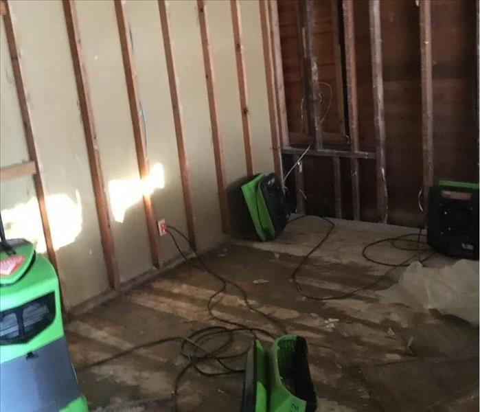 Room with bare walls and exposed subfloor