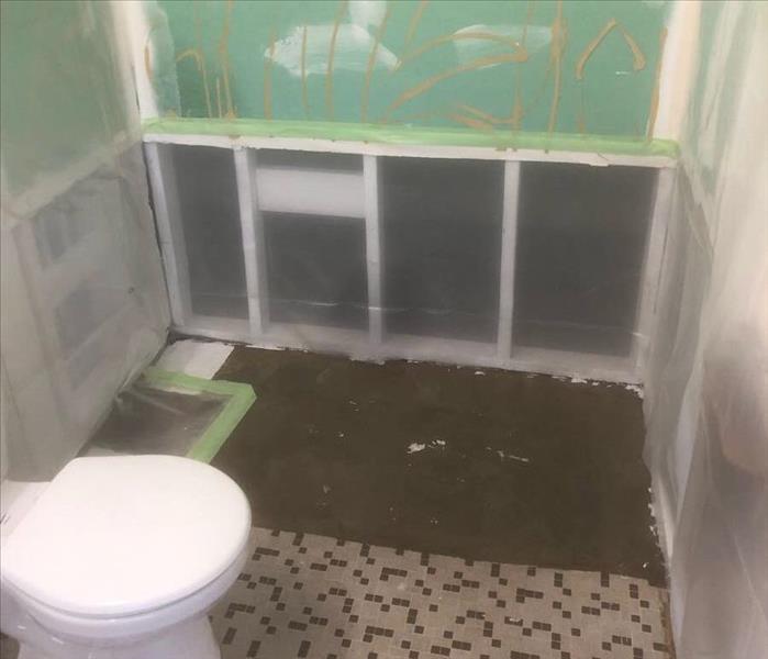vapor barriers, exposed walls in bathroom, greenboard backing
