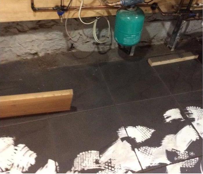 soot covering a white tile floor